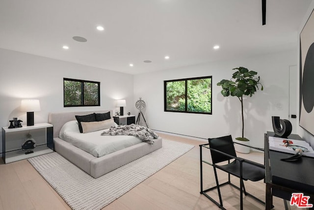 bedroom with light wood-type flooring