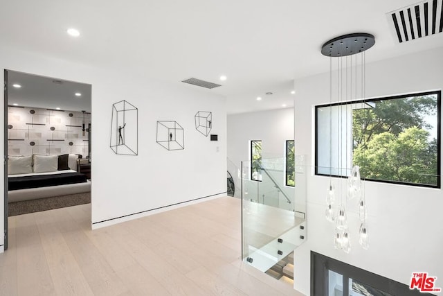 hall with light hardwood / wood-style floors