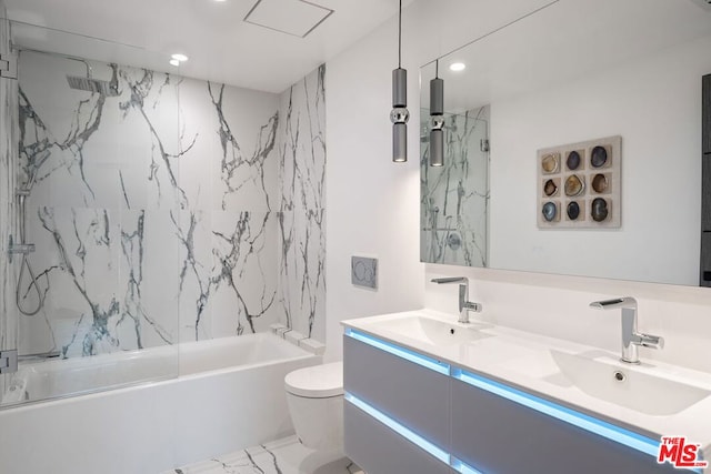 full bathroom featuring vanity, toilet, and combined bath / shower with glass door