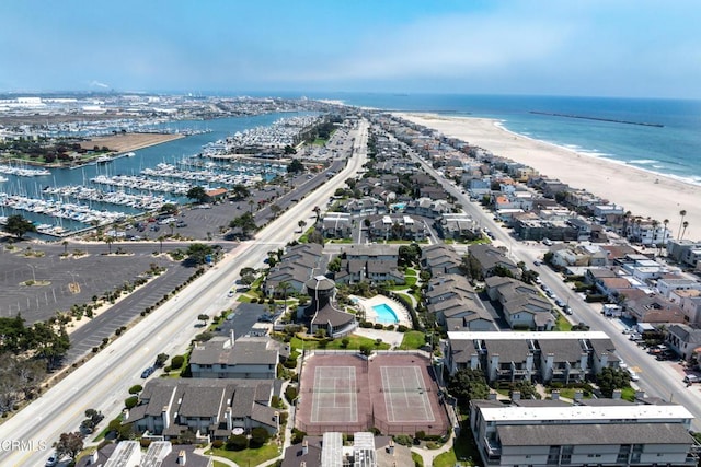 birds eye view of property featuring a view of the beach and a water view