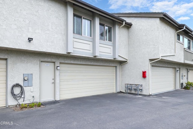 view of property exterior with a garage