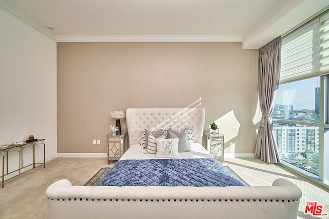 bedroom with crown molding and carpet floors