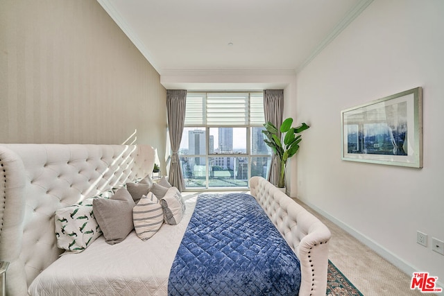 carpeted bedroom featuring ornamental molding and access to outside