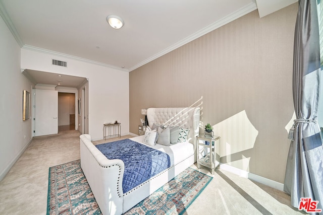 carpeted bedroom featuring crown molding