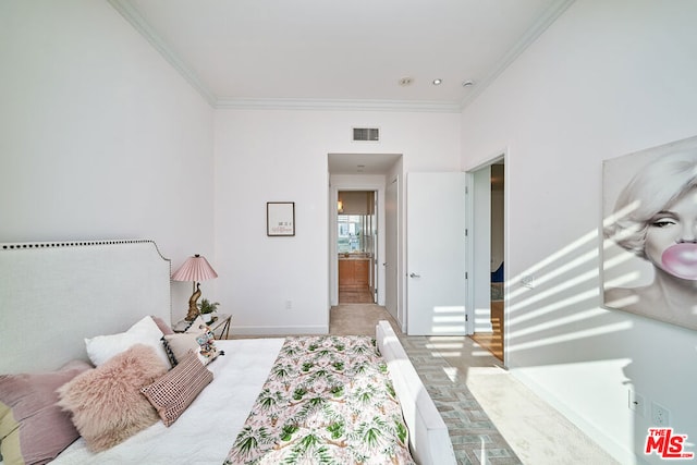 bedroom with crown molding