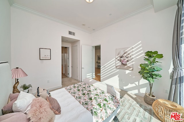 bedroom with ornamental molding