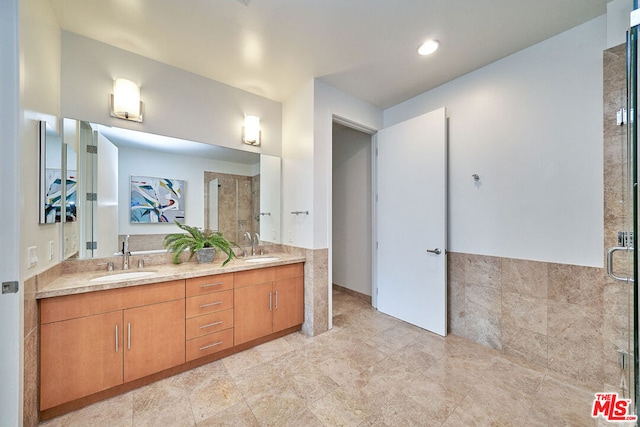 bathroom with an enclosed shower and vanity