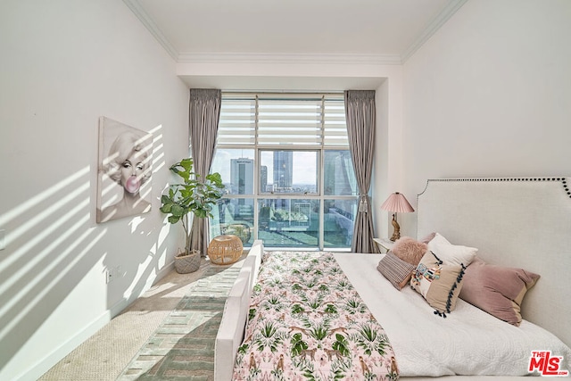 bedroom with crown molding and carpet floors