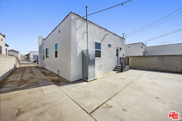 back of house featuring a patio