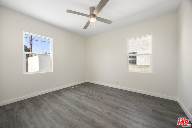 unfurnished room with ceiling fan and dark hardwood / wood-style floors