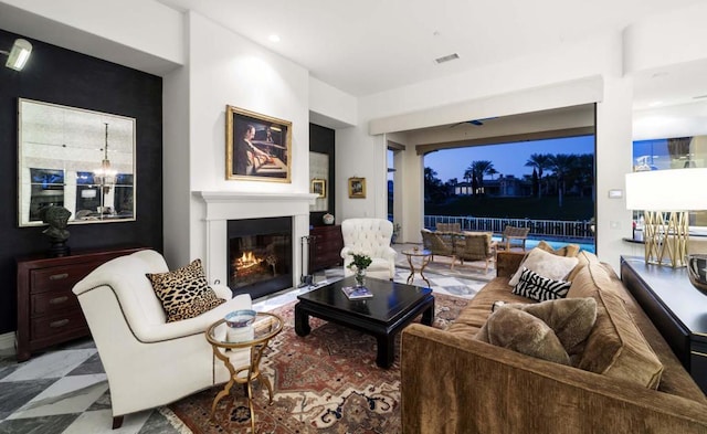 living room featuring a notable chandelier