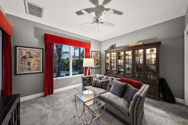 living room featuring carpet floors and ceiling fan