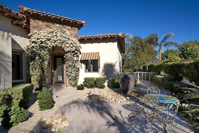 view of front of home with a patio area