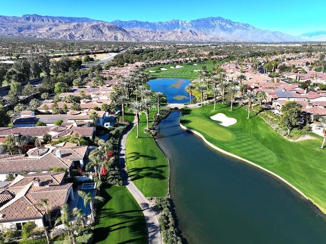 drone / aerial view featuring a water and mountain view