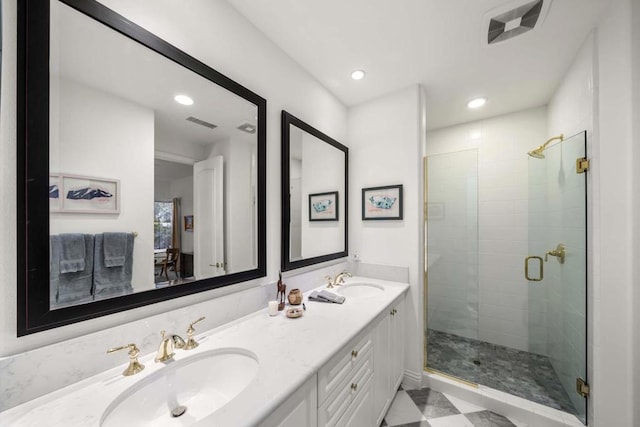 bathroom featuring vanity and a shower with door