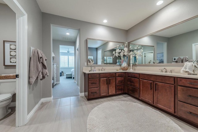 bathroom featuring toilet and vanity