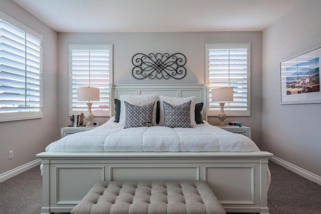 carpeted bedroom with multiple windows