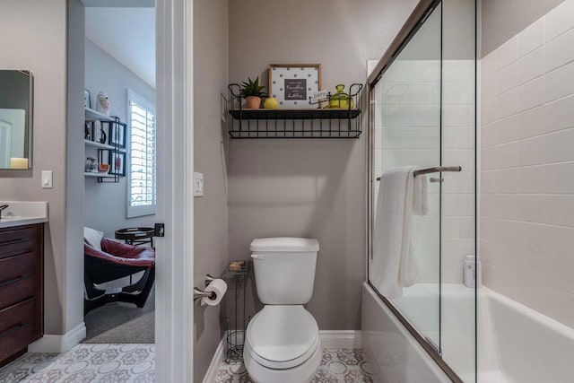 full bathroom with toilet, bath / shower combo with glass door, and vanity