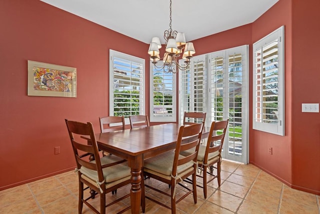 dining area with a healthy amount of sunlight and a chandelier