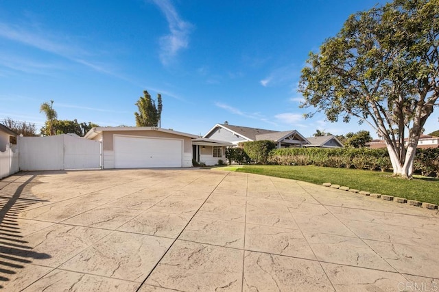 ranch-style home with a front lawn and a garage