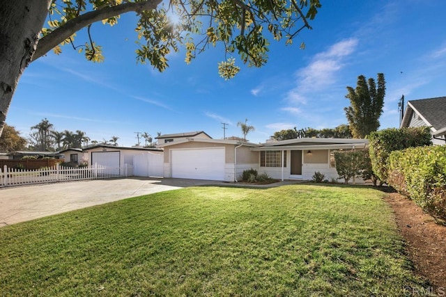 ranch-style home with a front yard and a garage