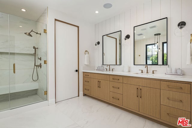 bathroom featuring vanity and walk in shower