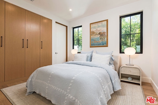 bedroom with light wood-type flooring