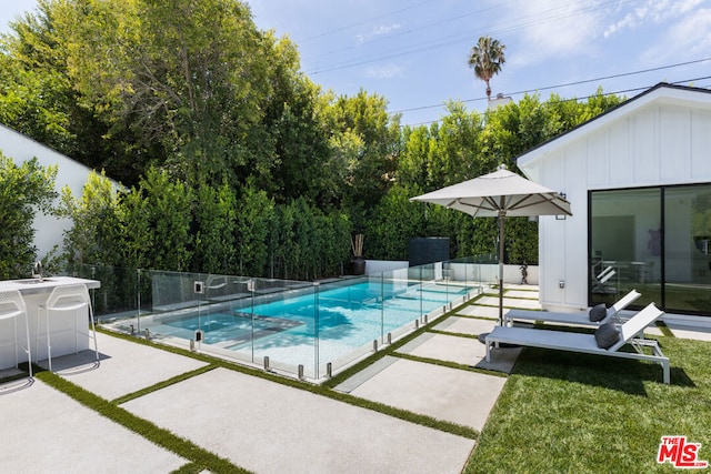 view of swimming pool featuring a patio