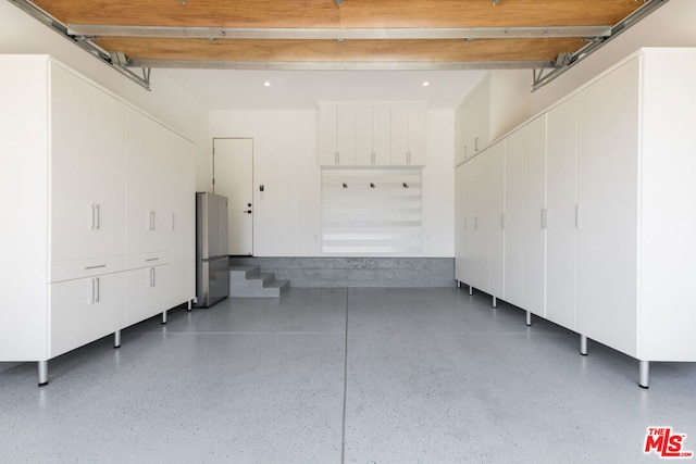 garage featuring stainless steel refrigerator