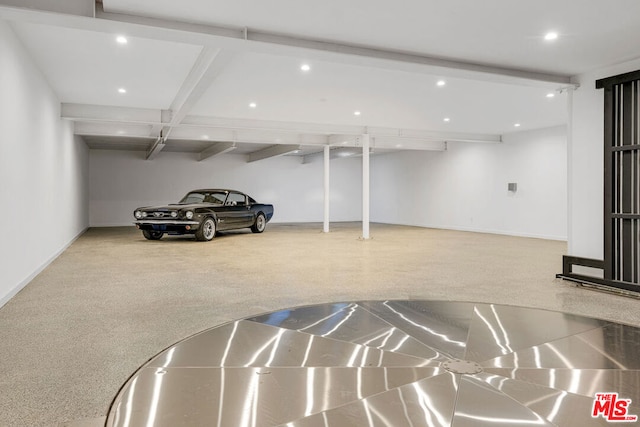 interior space featuring carpet and beam ceiling