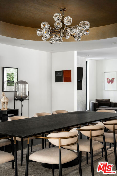 dining area featuring a notable chandelier