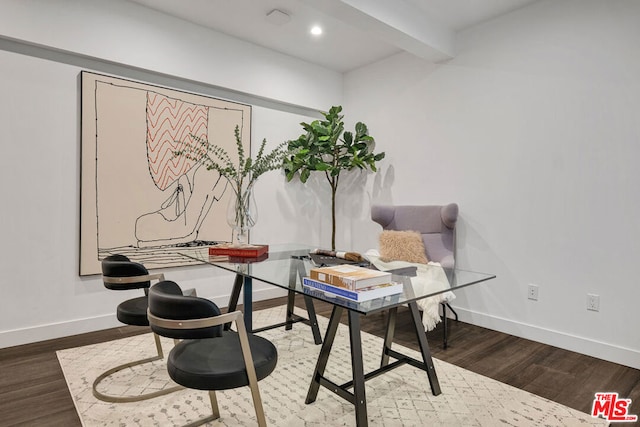 home office featuring wood-type flooring and beam ceiling