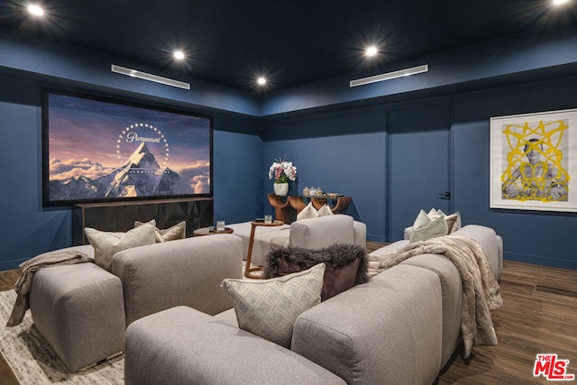 home theater room with wood-type flooring