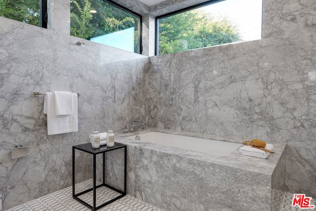 bathroom with tiled tub