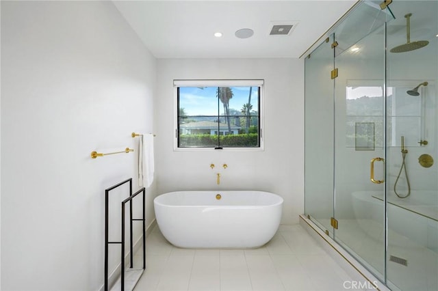 bathroom featuring separate shower and tub