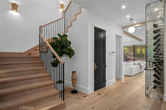 stairs with hardwood / wood-style floors