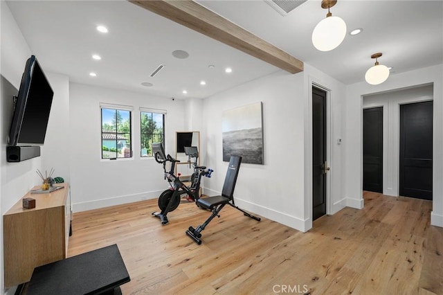 exercise area featuring light hardwood / wood-style flooring