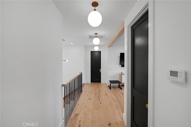 hall with light hardwood / wood-style floors