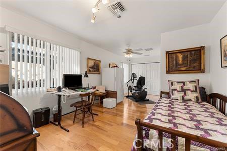 bedroom with light wood-type flooring