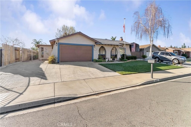 single story home featuring a front lawn and a garage