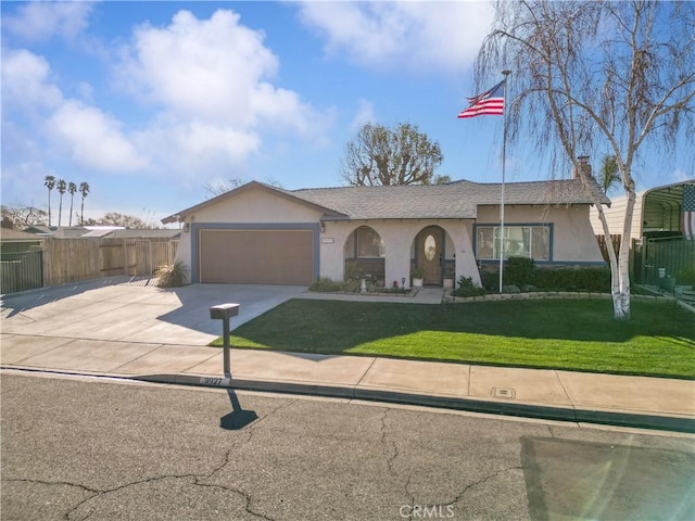 ranch-style house featuring a garage and a front yard