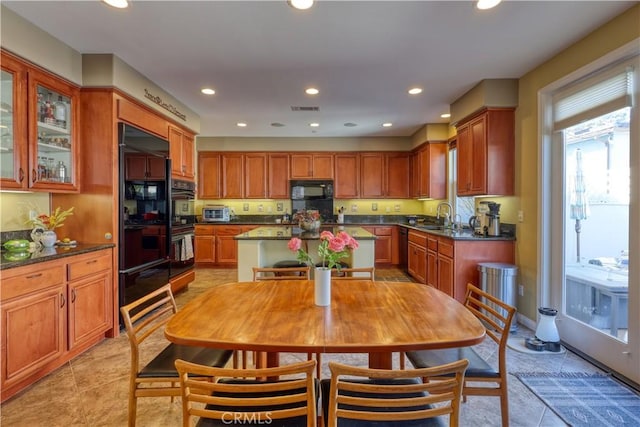 kitchen with visible vents, black microwave, a warming drawer, and recessed lighting