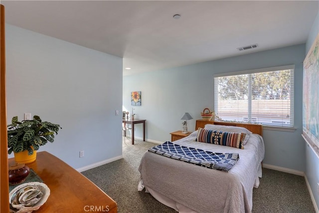 bedroom featuring baseboards, visible vents, and carpet flooring