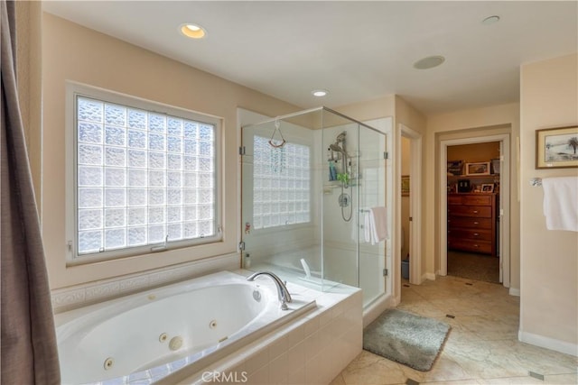 full bathroom with a whirlpool tub, a shower stall, a spacious closet, and recessed lighting