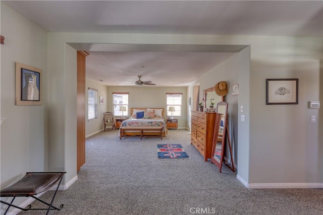 carpeted bedroom featuring baseboards