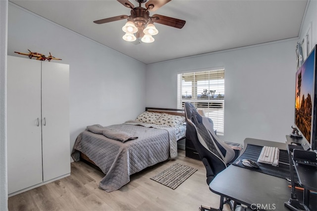 bedroom with ceiling fan and light wood-type flooring