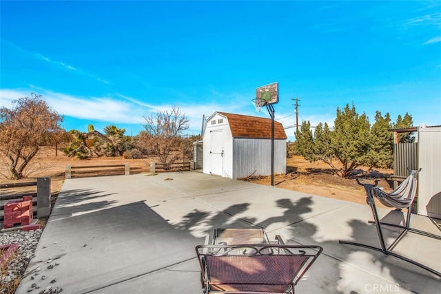 view of patio featuring a storage unit