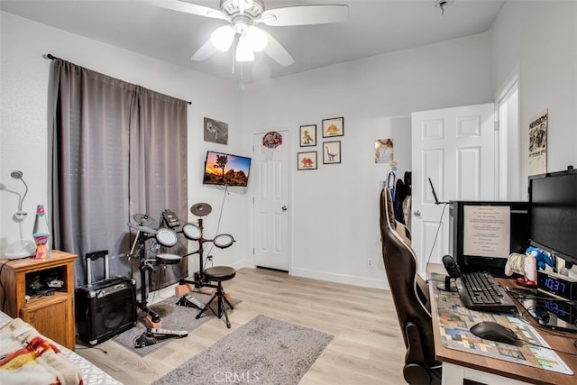 office space with ceiling fan and light wood-type flooring