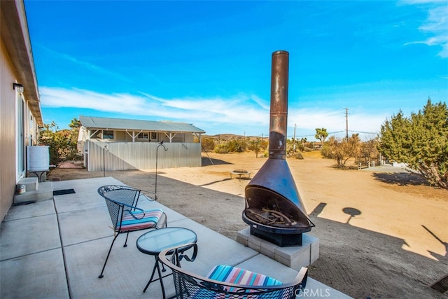 view of patio featuring an outdoor fire pit