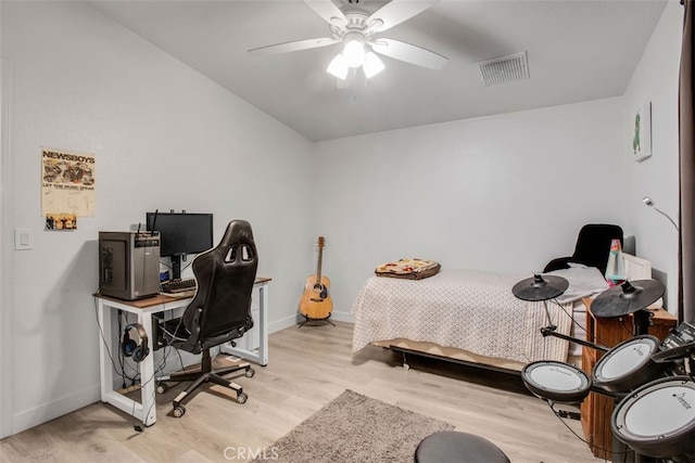 bedroom with ceiling fan and light hardwood / wood-style flooring